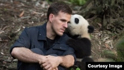 Jake Owens and Qian Qian at the Chengdu Panda Base in China. (Warner Bros./ IMAX Photo)