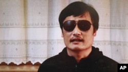 In this image made from video, blind legal activist Chen Guangcheng is seen on a video posted to YouTube, April 27, 2012 by overseas Chinese news site Boxun.com. 