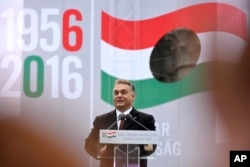 FILE - Hungarian Prime Minister Viktor Orban delivers a speech during the commemoration ceremony of the 1956 Hungarian revolution and freedom fight against communism and Soviet rule in downtown Budapest, Hungary, Oct. 23, 2016. Orban likes the immigration stand of U.S. Republican presidential nominee Donald Trump.