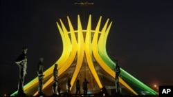 The Metropolitan Cathedral is illuminated in Brazil's national colors in honor of the upcoming World Cup, in Brasilia, Brazil, June 6, 2014.