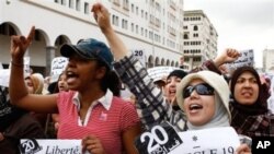 Women protest during a rally denouncing corruption, demanding better civil rights and demanding a new constitution, in Casablanca, April 24, 2011