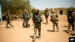 FILE - French soldiers are seen securing an area near Gao, northern Mali, Feb.10, 2013.