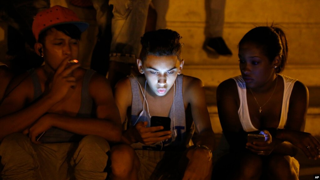 FILE - Cuba's government announced on Tuesday, Dec. 4, 2018 that its citizens will be offered full internet access on mobile phones starting Thursday, Dec. 6, becoming one of the last nations to do so. (AP Photo/Desmond Boylan, File)