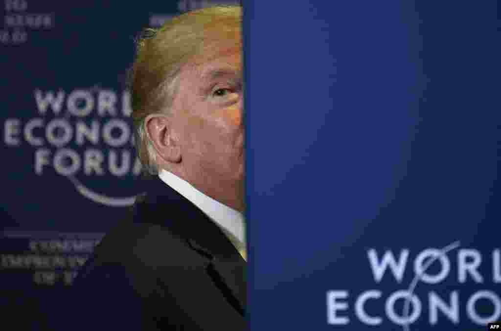 U.S. President Donald Trump looks back as a member of the press shouts a question following a press conference at the&nbsp;World Economic Forum in Davos, Switzerland.