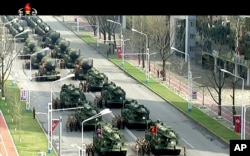 In this image made from video broadcast by North Korean broadcaster KRT, military vehicles prepare for a parade at Kim Il Sung Square in Pyongyang, April 15, 2017. North Korean leader Kim Jong Un has appeared in a massive parade in the capital, Pyongyang, North Korea.