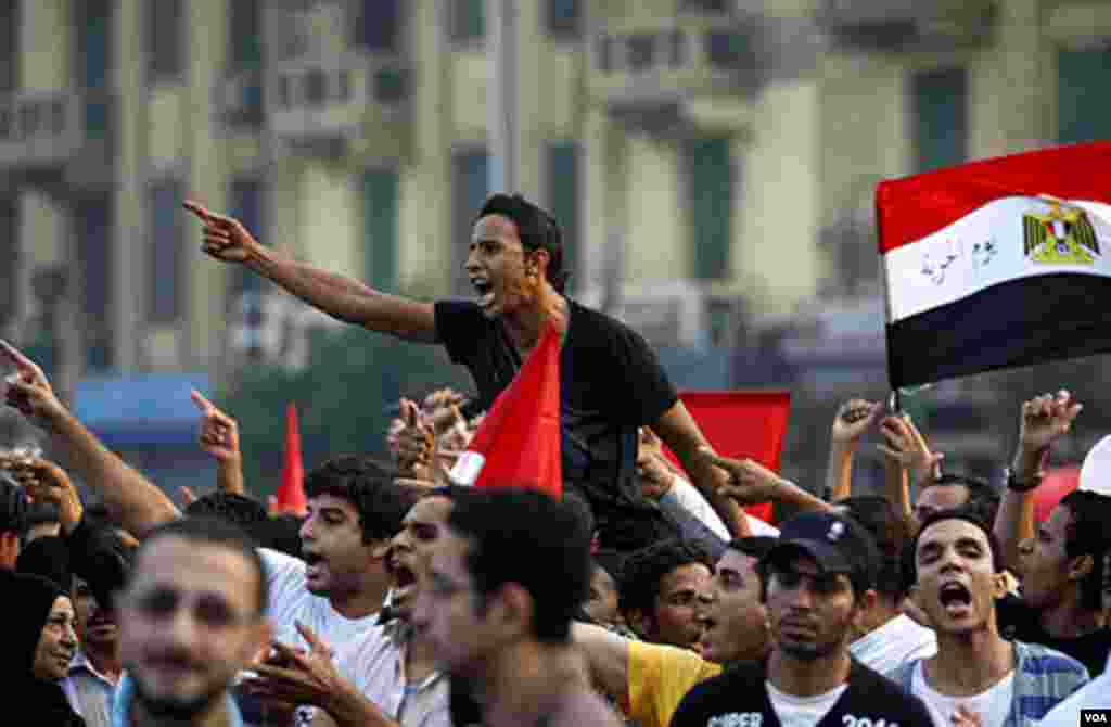 Egyptian protesters chant as they hold a demonstration after Eid al-Fitr in Tahrir Square in Cairo, Egypt, Aug. 30, 2011. AP