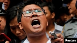 Reuters journalist Wa Lone leaves Insein court after hearing the verdict in Yangon, Myanmar, Sept. 3, 2018.