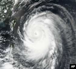 Typhoon Neoguri churns toward Okinawa and southern Japan on Tuesday, July 8, 2014.
