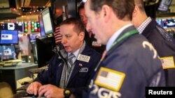 Traders work on the floor of the New York Stock Exchange in New York, Dec. 28, 2018. 