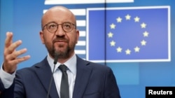 FILE - European Council President Charles Michel attends a news conference following a virtual summit with European Commission President Ursula von der Leyen and European leaders in Brussels, Aug. 19, 2020.