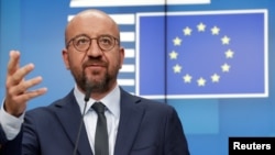 FILE - European Council President Charles Michel attends a news conference following a virtual summit with European Commission President Ursula von der Leyen and European leaders in Brussels, August 19, 2020.