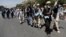 FILE - Afghan peace marchers arrive in Kabul, Afghanistan, June 18, 2018.