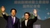 FILE - Taiwan President-elect Lai Ching-te, of Democratic Progressive Party's and his running mate, Hsiao Bi-khim, wave as they hold a press conference, following the victory in the presidential elections, in Taipei, Taiwan Jan. 13, 2024.