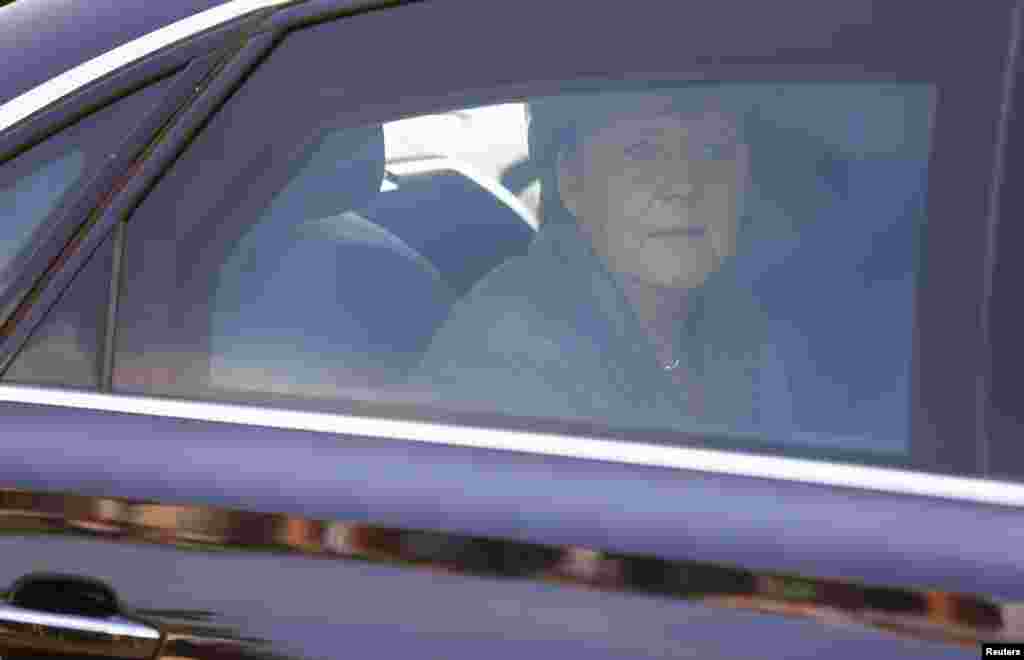 German Chancellor Angela Merkel leaves after her visit to an asylum center in the eastern German town of Heidenau near Dresden, Aug. 26, 2015.