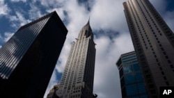 The Chrysler Building, center, stands next to other midtown skyscrapers, Jan. 9, 2019, in New York.