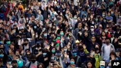 Protesters raise their hand to symbolize the five demands of the pro-democracy movement during a rally for young and elderly pro-democracy demonstrators in Hong Kong, Nov. 30, 2019.