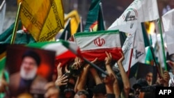 People carry the coffin of Iran's Islamic Revolutionary Guards Corps (IRGC) commander Abbas Nilforushan during his funeral procession at the Imam Hussein shrine in Iraq's holy central city of Karbala, Oct. 14, 2024.