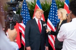 FILE - VOA contributor Greta Van Susteren interviews President Donald Trump in Singapore, Aug 12, 2018. (White House photo by Shealah Craighead)