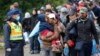 Hungarian Minister: World Quotas Needed for Refugees