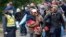 Group of migrants walk to board a train at a station near the village of Zakany, Hungary, Sept. 24, 2015.