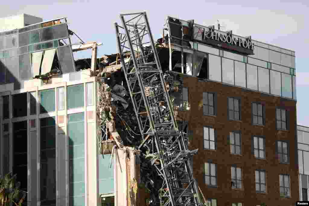 A view shows a collapsed construction crane that fell on the building that also hosts the offices of the Tampa Bay Times, after Hurricane Milton made landfall, in downtown St. Petersburg, Florida, Oct. 10, 2024.