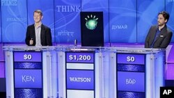 "Jeopardy" champions Ken Jennings, left, and Brad Rutter, right, look on as an IBM computer called Watson beats them to the buzzer to answer a question during a practice round.