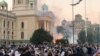 Serbia, Belgrade, Demonstrators stand among tear gas during an anti-government rally, amid the spread of the coronavirus disease