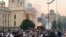 Serbia, Belgrade, Demonstrators stand among tear gas during an anti-government rally, amid the spread of the coronavirus disease