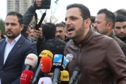 FILE - Shaswar Abdulwahid, head of the Iraqi Kurdish New Generation Movement, speaks during a rally to protest corruption and scarcity of services, in Freedom Square in the northern city of Sulaimaniyah, Feb. 22, 2020.