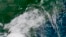 FILE - In this image provided by NOAA, Tropical Storm Gordon approaches the United States on Sept. 4, 2018.