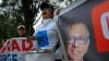 FILE - Supporters of former Ecuadorean Vice President Jorge Glas, pictured on banner, demonstrate outside the National Court of Justice during a court hearing in his case, in Quito, April 12, 2024.