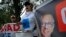 FILE - Supporters of former Ecuadorean Vice President Jorge Glas, pictured on banner, demonstrate outside the National Court of Justice during a court hearing in his case, in Quito, April 12, 2024.