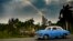 An old American car is seen in Havana as a rainbow appears in the sky, on February 3, 2022.
