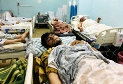 Wounded Afghans at a hospital after deadly suicide bombings outside the airport in Kabul killed at least 95 Afghans and 13 U.S. troops on August 26, 2021. (Mohammad Asif Khan/AP)