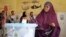 FILE - A woman casts her vote in the presidential election in Hargeisa, in the semiautonomous region of Somaliland, Nov. 13, 2017.