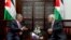 Palestinian President Mahmoud Abbas, right, meets with Jordan's King Abdullah II at his office in the West Bank city of Ramallah, Monday, Aug. 7, 2017.