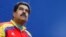 Presiden Venezuela Nicolas Maduro melihat ke luar Istana Miraflores di Karakas (15/3). (Reuters/Jorge Silva)