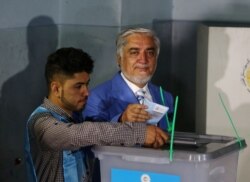 Afghan presidential candidate Abdullah Abdullah casts his vote at a polling station in Kabul, Afghanistan, Sept. 28, 2019.