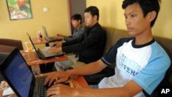 Cambodian men are using internet at a coffee shop in Phnom Penh, file photo. 