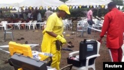 Bomb experts from the military secure the scene of an explosion at the new Catholic church in the northern Tanzanian town of Arusha, May 5, 2013.
