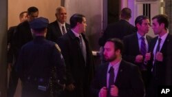 Vice President-elect Mike Pence, top center, leaves the Richard Rodgers Theatre after a performance of "Hamilton," in New York, Friday, Nov. 18, 2016. 