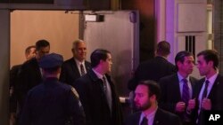 Vice President-elect Mike Pence, top center, leaves the Richard Rodgers Theatre after a performance of "Hamilton," in New York, Friday, Nov. 18, 2016. 