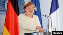 German Chancellor Angela Merkel speaks during a joint press conference with French President Emmanuel Macron (not pictured) after a bilateral meeting at Meseberg Castle, the federal government's guest house, in Meseberg, Germany, June 29, 2020. 