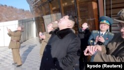 North Korean leader Kim Jong Un watches a long range rocket launch into the air in North Korea, in this photo released by Kyodo, Feb. 7, 2016. (REUTERS/Kyodo)