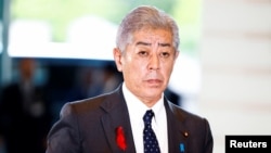 FILE - Japan's Foreign Minister Takeshi Iwaya arrives at Prime Minister Shigeru Ishiba's official residence in Tokyo, Japan, Oct. 1, 2024. 