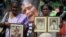 Women hold the portraits of their relatives, who disappeared at a protest, as they demand an investigation for those who went missing, during an event to mark the Valentine's Day in Colombo, Sri Lanka, February 14, 2020. 
