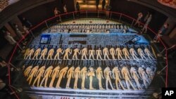 FILE - People visit the new National Museum of Egyptian Civilization in Old Cairo, Apr. 24, 2021. 