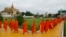 Buddhist monks heading for receiving food from devotees during the three-day Buddhist ceremony to dedicate to dead of former King Norodom Sihanouk in front of Royal Palace, in Phnom Penh, file photo. 