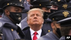 Surrounded by Army cadets, President Donald Trump watches the first half of the 121st Army-Navy Football Game in Michie Stadium at the United States Military Academy, Dec. 12, 2020, in West Point, N.Y.
