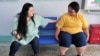 FILE - Patients chat with each other at a weight loss center in Changchun, Jilin province in northeastern China June 20, 2010. 